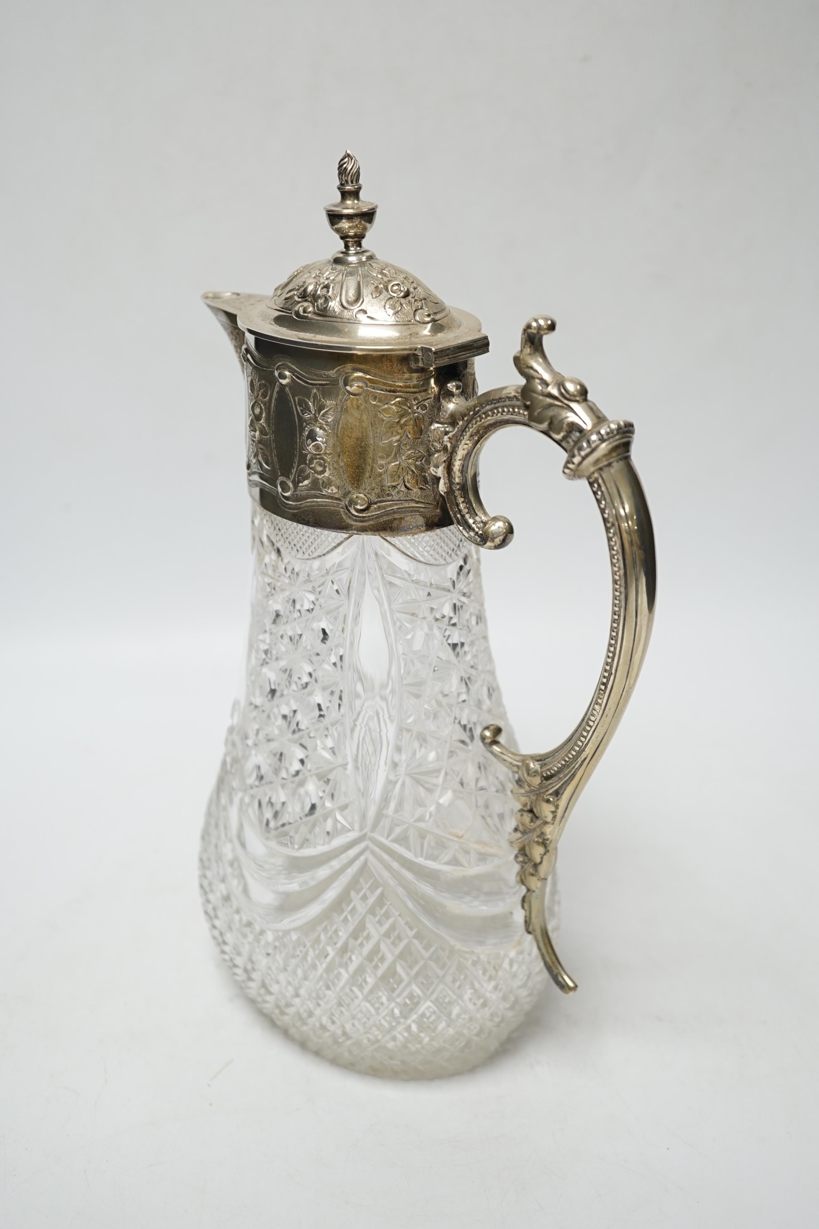 A late Victorian silver mounted cut glass claret jug, Hukin & Heath, London, 1896, 27.8cm.